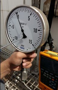 Pressure Gauge with adjustable screw inside its mechanical.